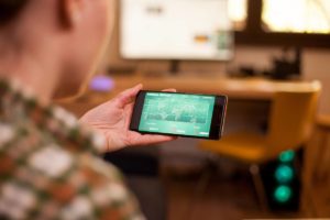 back-view-of-businesswoman-checking-stock-market