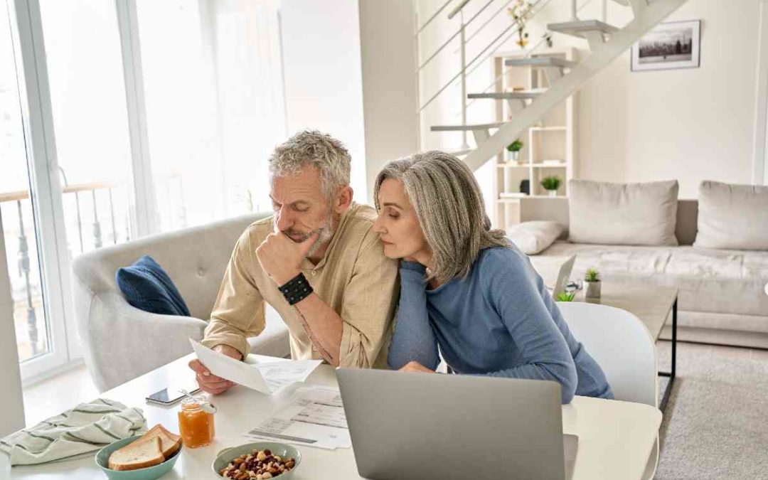 A financial advisor reviewing tax documents with a client, emphasizing the potential impact of the Tax Plan.