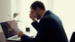 Investor looking at today's stock market report