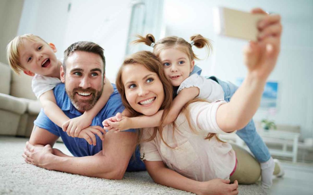 Family reviewing life insurance options with a financial advisor, symbolizing the importance of financial planning and protection