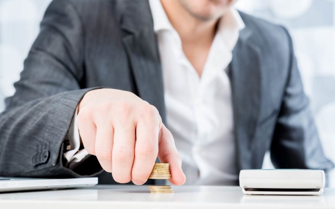 Person reviewing a monthly budget with increased costs for gas, groceries, and household expenses due to inflation