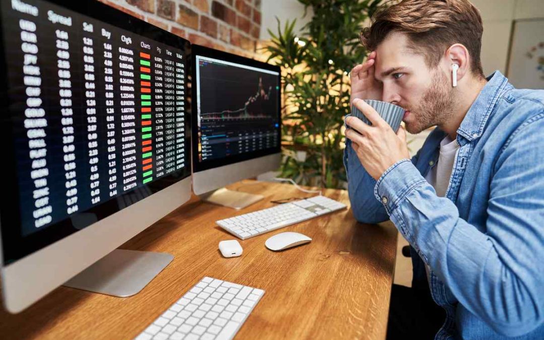 stock professional watching chart with rising and falling trends, symbolizing investor sentiment shifts between fear and greed.