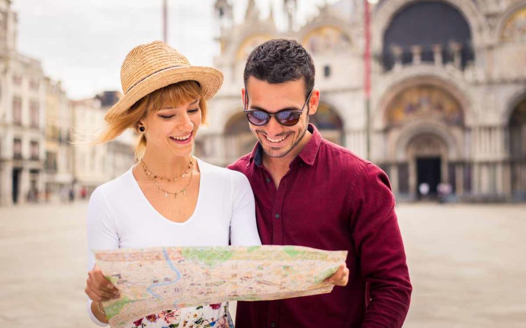 “Couple overlooking the Amalfi Coast in Italy, symbolizing the fulfillment of a carefully budgeted travel dream.