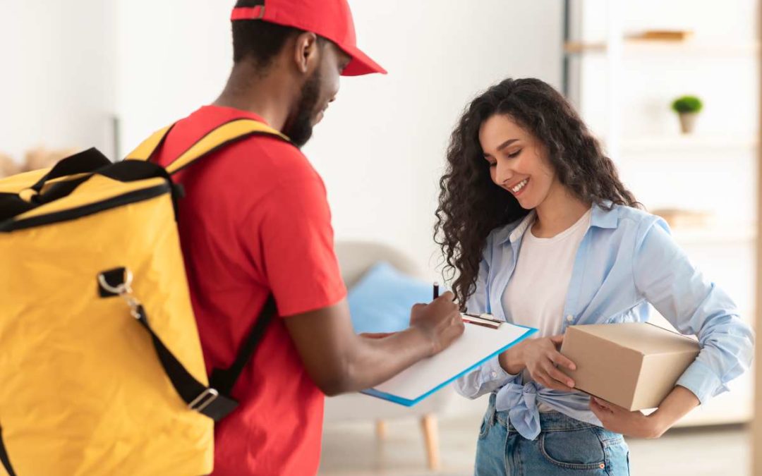 A delivery driver holding a phone and grocery bags near a car, representing flexible side hustles